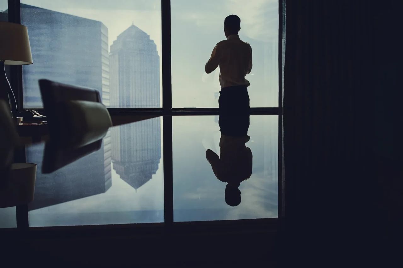 man near window