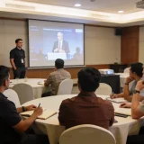 workshop participants watching video